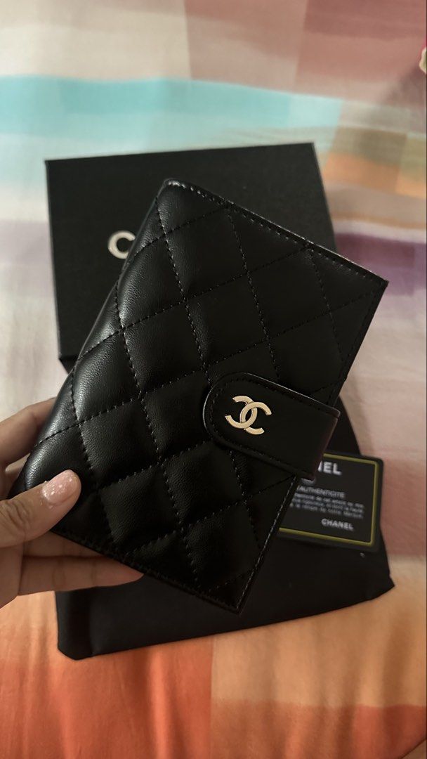 Chanel Quilted Leather Bi-Fold Wallet Black (Category: Luxury Bags & Wallets) located in Makati City. Submitted by janeabat (Listing ID 1445490924, Image 1). Description: Original GWP - Authentic GWP Chanel Wallet - Classic Black Quilted Leather - Luxurious Deep Burgundy Interior - Features Zippered Coin Pocket - Multiple Card Slots - Comes with Original Box - Includes Authenticity Card - Made in Italy.