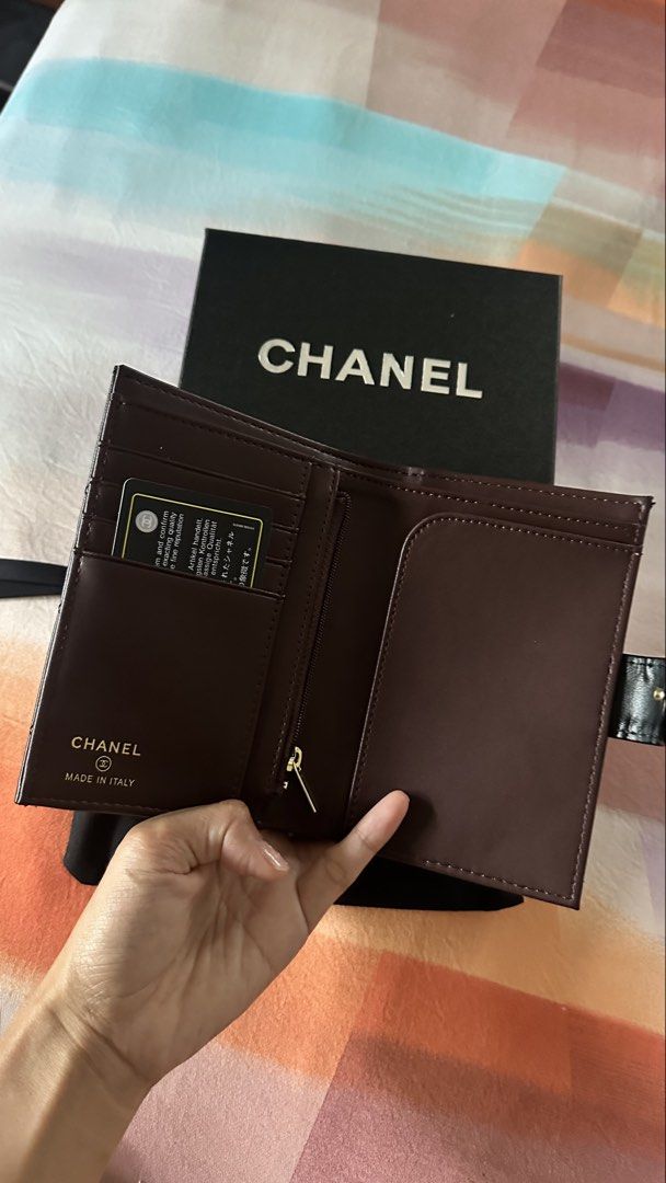 Chanel Quilted Leather Bi-Fold Wallet Black (Category: Luxury Bags & Wallets) located in Makati City. Submitted by janeabat (Listing ID 1445490924, Image 2). Description: Original GWP - Authentic GWP Chanel Wallet - Classic Black Quilted Leather - Luxurious Deep Burgundy Interior - Features Zippered Coin Pocket - Multiple Card Slots - Comes with Original Box - Includes Authenticity Card - Made in Italy.