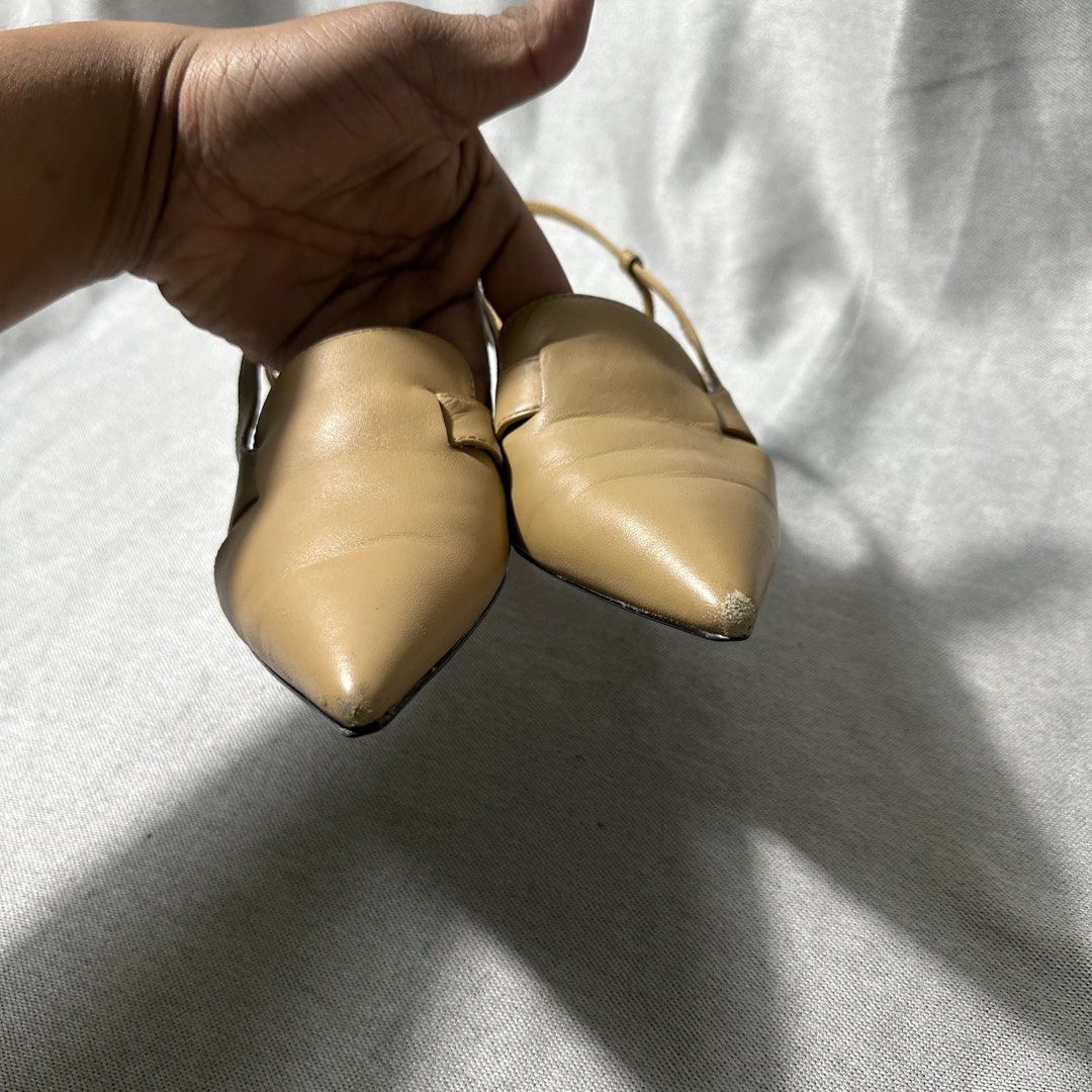 Charles & Keith Slingback Heels Beige Pointed Toe Kitten Heel (Category: Heels) located in Bayombong. Submitted by rochelle_archive_garments (Listing ID 1445577603, Image 3). Description: - Brand: Charles & Keith - Color: Beige - Style: Slingback heels - Toe: Pointed - Heel: Low kitten heel - Details: Side cut-outs, adjustable ankle strap - Condition: Minor scuffs on toe tips - Occasion: Dress up or down.