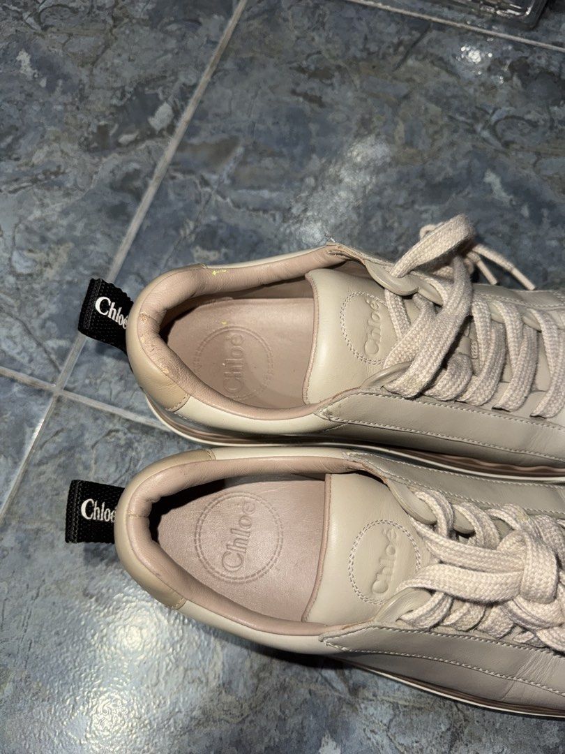 Chloe Lauren Sneakers Beige leather (Category: Sneakers & Footwear) located in Makati City. Submitted by vinsanity41546 (Listing ID 1445586910, Image 2). Description: - Beige Chloe Lauren sneakers - Signature wavy sole - Chloe logo stamped inside - Ribbon detail on the heel - Extremely comfortable and stylish - Perfect for casual outfits.