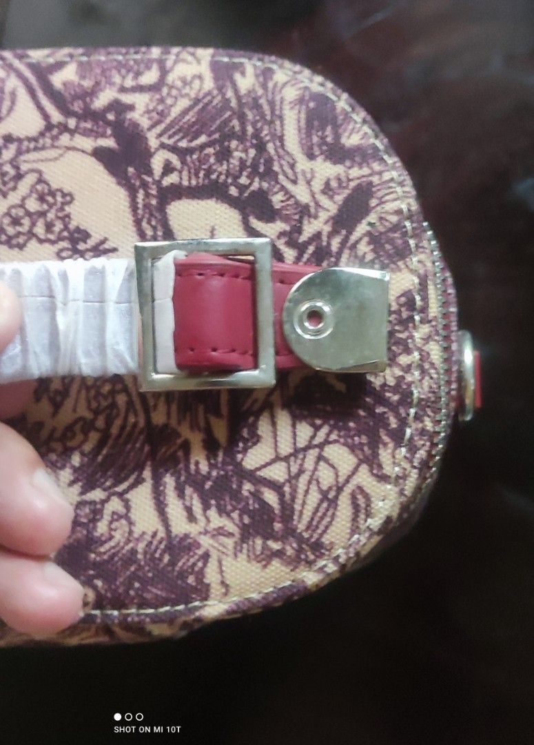 Christian Dior Vanity Case Toile de Jouy (Category: Luxury Bags & Wallets) located in Surigao. Submitted by mysticdog.151178 (Listing ID 1445456573, Image 1). Description: - Christian Dior Vanity Case - Iconic Toile de Jouy print - Elegant burgundy trim - Luxurious gold hardware - Secure zipper closure - Convenient top handle - Detachable strap for versatility - Ideal for travel or everyday essentials.