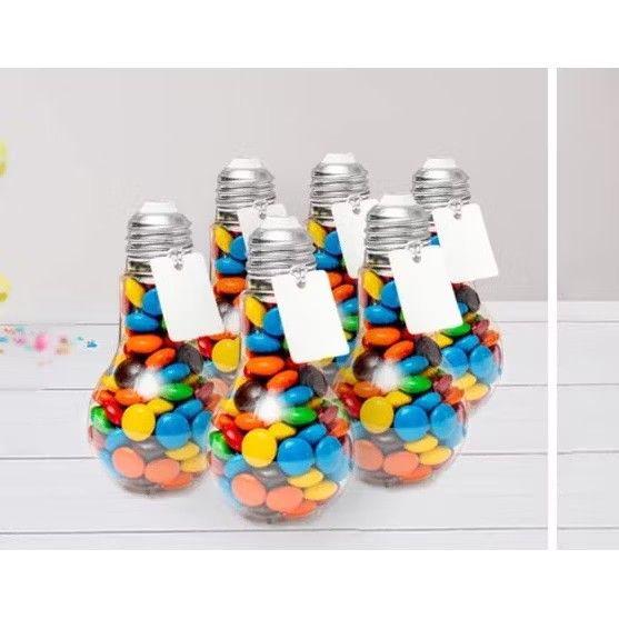 Clear Light Bulb Shaped Candy Containers for Parties (Category: Lighting) located in Muntinlupa City. Submitted by jsassorteditems (Listing ID 1445533165, Image 3). Description: - Unique light bulb shaped clear plastic containers. - Ideal for party favors, candy, or small trinkets. - Fill with chocolates, candies, or use for DIY projects. - Secure screw-on cap for easy opening and closing. - Each container comes with a small tag for personalizati