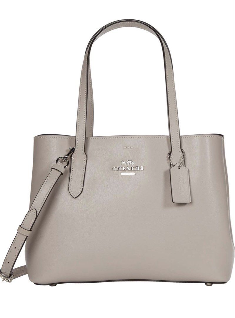Coach Avenue (Category: Luxury Bags & Wallets) located in Carmona. Submitted by dangsg (Listing ID 1445547900, Image 2). Description: - 2-way handbag (hand carry or shoulder wear) - Detachable crossbody strap included - perfect for everyday errands, office days, school, casual outings, or travel. - Spacious interior for your daily essentials - Base is sturdy - Neutral beige/grey color RFS: di nagamit since nabili 📍Cavite.