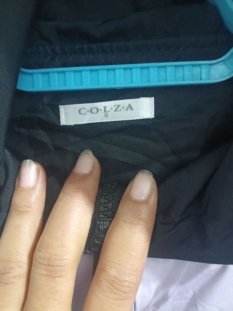 Colza Colorblock Hooded Windbreaker Jacket Size S (Category: Coats, Jackets and Outerwear) located in Manila. Submitted by reziahbant00650 (Listing ID 1445542213, Image 2). Description: - Lightweight windbreaker jacket by Colza - Stylish colorblock design: purple, black, and white panels - Features a hood with drawstring for adjustable coverage - Convenient zip-up front - Includes practical side pockets - Ideal for casual outings or outdoor adven