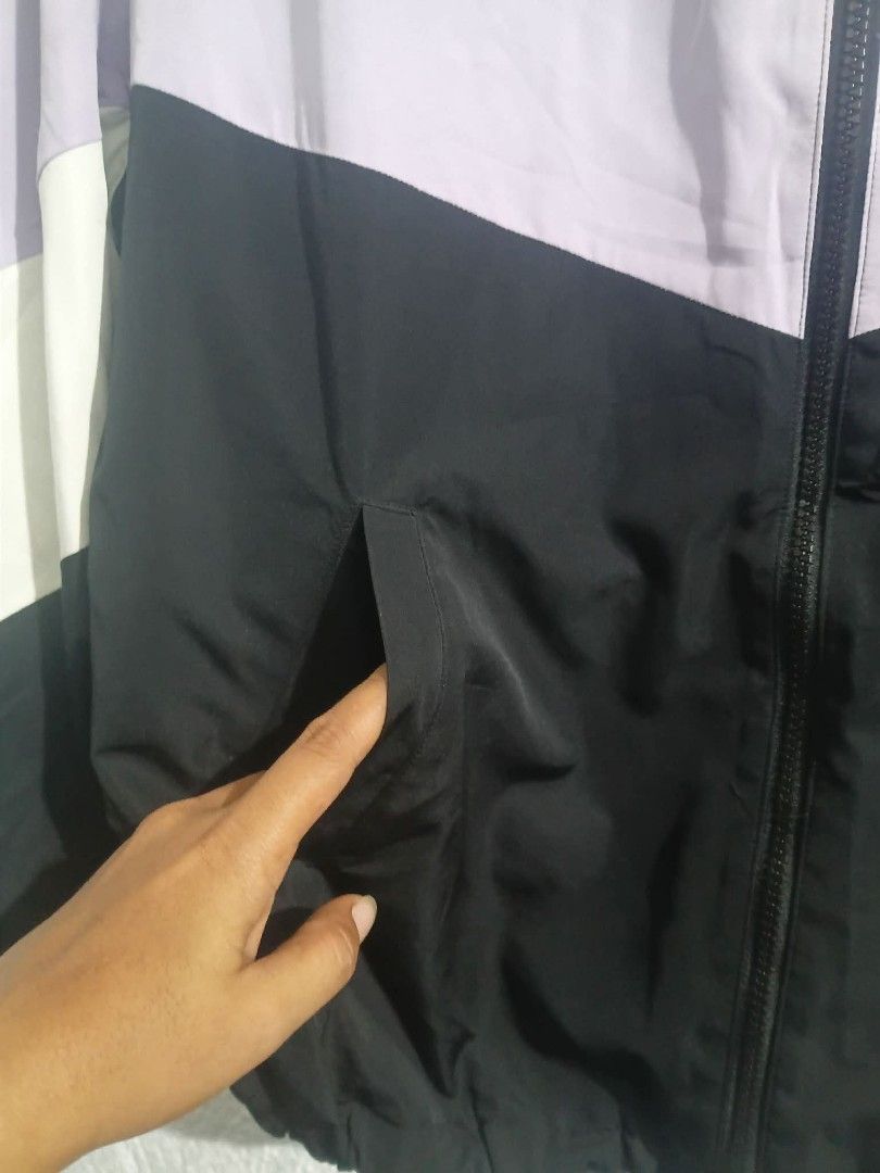 Colza Colorblock Hooded Windbreaker Jacket Size S (Category: Coats, Jackets and Outerwear) located in Manila. Submitted by reziahbant00650 (Listing ID 1445542213, Image 3). Description: - Lightweight windbreaker jacket by Colza - Stylish colorblock design: purple, black, and white panels - Features a hood with drawstring for adjustable coverage - Convenient zip-up front - Includes practical side pockets - Ideal for casual outings or outdoor adven