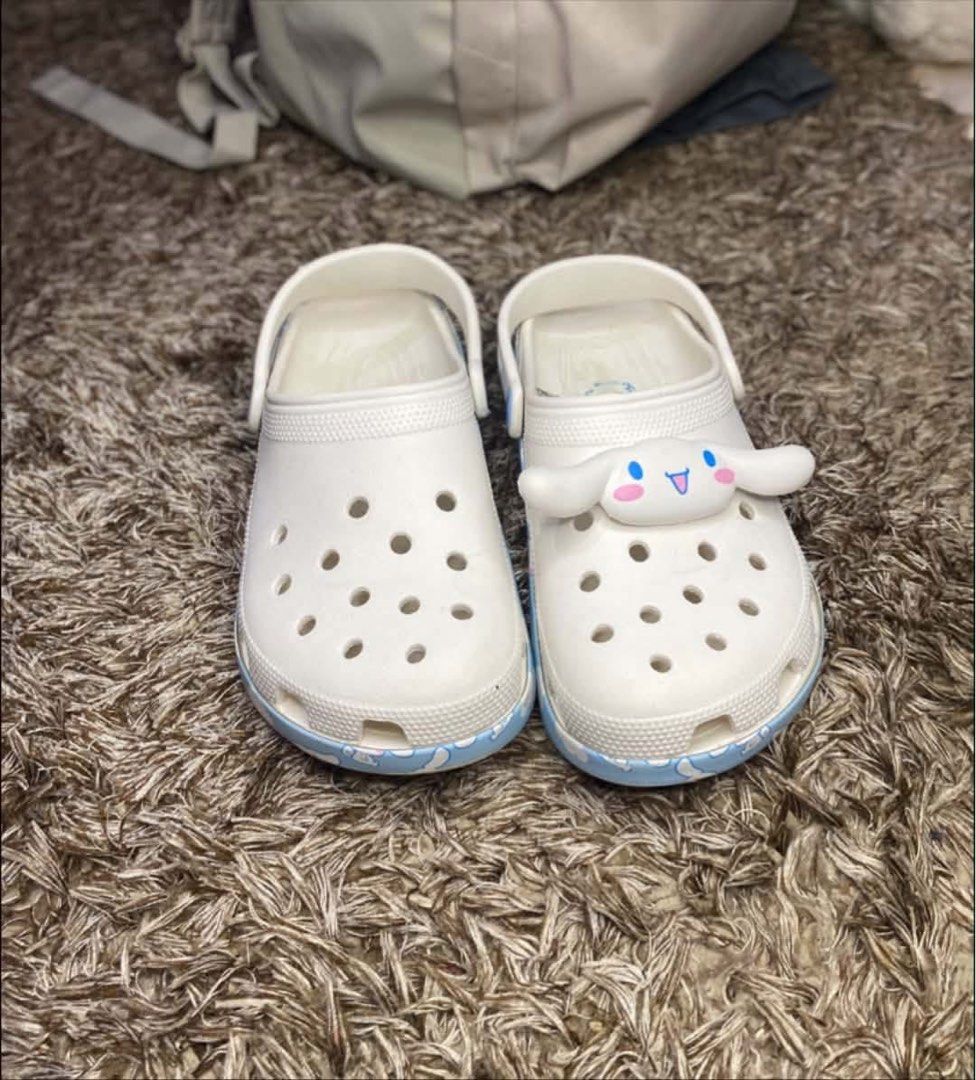Crocs Hello Kitty Cinnamoroll Classic Clog White Blue (Category: Slippers and slides) located in Butuan. Submitted by rhose9224 (Listing ID 1445605833, Image 1). Description: - White Cinnamoroll Crocs - Features blue cloud and character details - Includes a cute Cinnamoroll Jibbitz charm on the front - Easy slip-on, slip-off design - Ideal for casual wear or lounging - Fun Sanrio collaboration.