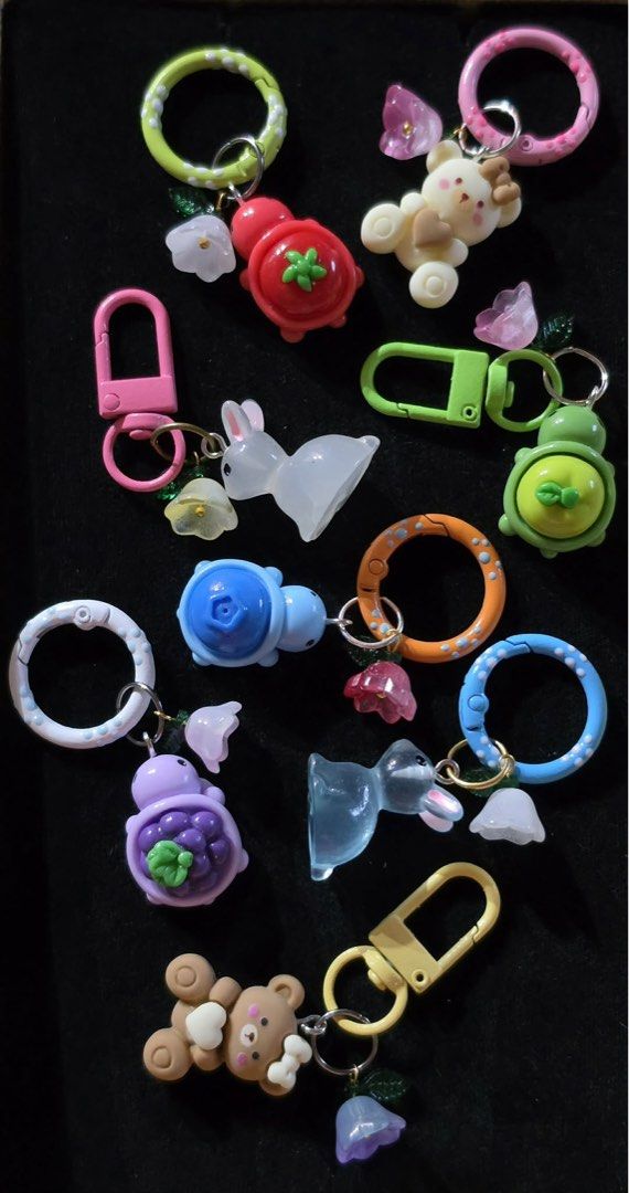 Cute Animal & Fruit Themed Keychains with Charms (Category: Character Goods) located in Los Banos. Submitted by acgalamgam (Listing ID 1445490526, Image 2). Description: - Adorable handmade keychains featuring bears, bunnies, turtles, and fruit designs. - Each keychain includes a colorful hoop and a flower charm. - Ideal for decorating bags, backpacks, or as a personal accessory. - Mix and match your favorite designs! - Available for purchase ind