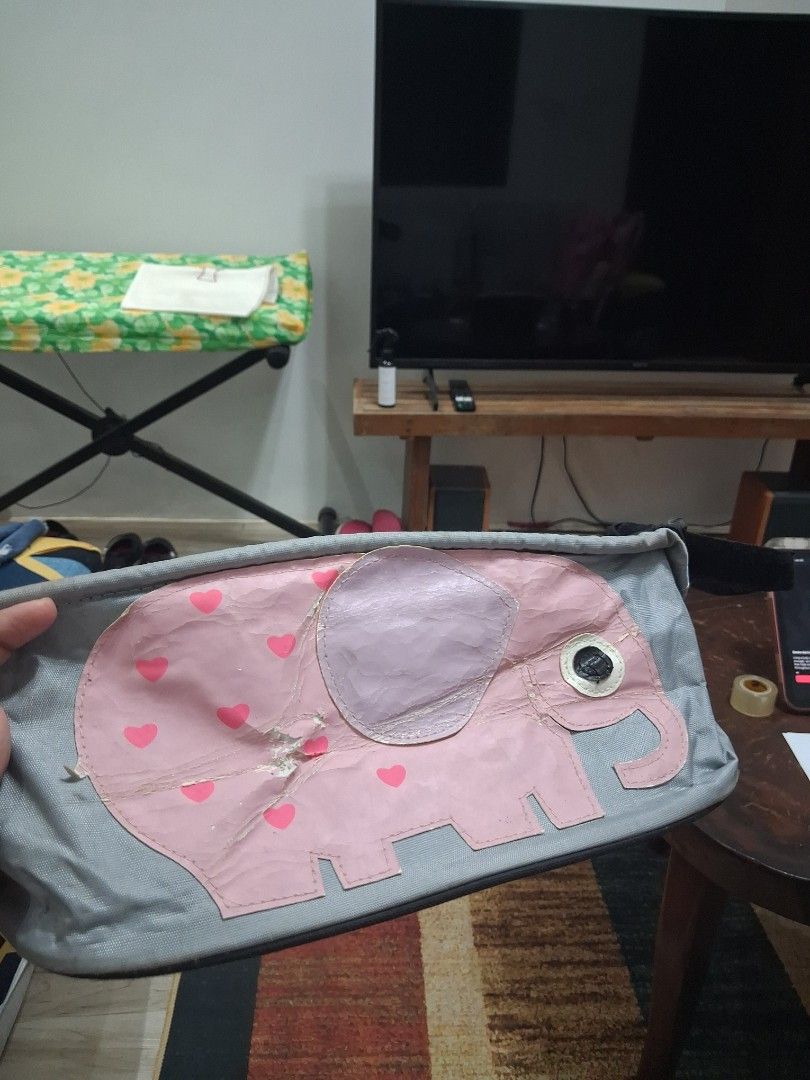 Cute Pink Elephant Pencil Case Organizer Pouch (Category: Strollers) located in Guagua. Submitted by lavieestviah (Listing ID 1445513703, Image 1). Description: - 🎀▶️Adorable grey pouch featuring a cute pink elephant design used as storage organizer in stroller. - ▶️🎀🫶Multiple interior compartments to keep pens and stationery neatly organized. -➡️▶️ with Flaws Visible not for maarte - ▶️Convenient side loop for easy carrying on the go. -▶️ Ide
