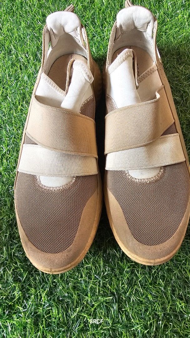 ECCO S.T.1 Lite Slip-On Sneakers (Category: Sneakers) located in Quezon City. Submitted by geminimomma2 (Listing ID 1445434304, Image 2). Description: - ECCO S.T.1 Lite slip-on sneakers - Color: Tan and beige mesh - Features elastic straps for easy wear - Known for comfort and everyday practicality - Soles show some signs of wear.