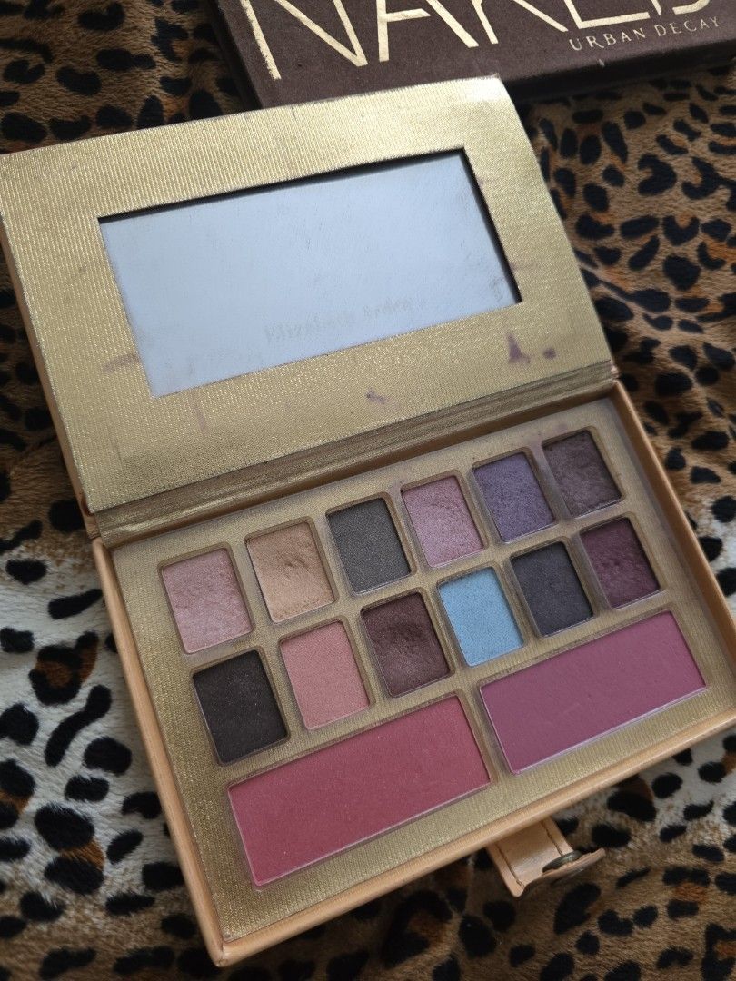 Elizabeth Arden Eyeshadow & Blush Palette (Category: Makeup) located in Manila. Submitted by foxydivas (Listing ID 1445575384, Image 1). Description: - Elizabeth Arden Eyeshadow & Blush Palette - Includes 12 eyeshadow shades and 2 blush shades - Features a mix of shimmery and matte finishes - Comes in a book-like case with a built-in mirror - Exterior of the case has some marks - Ideal for travel or everyday makeup looks - bought it at 7k .