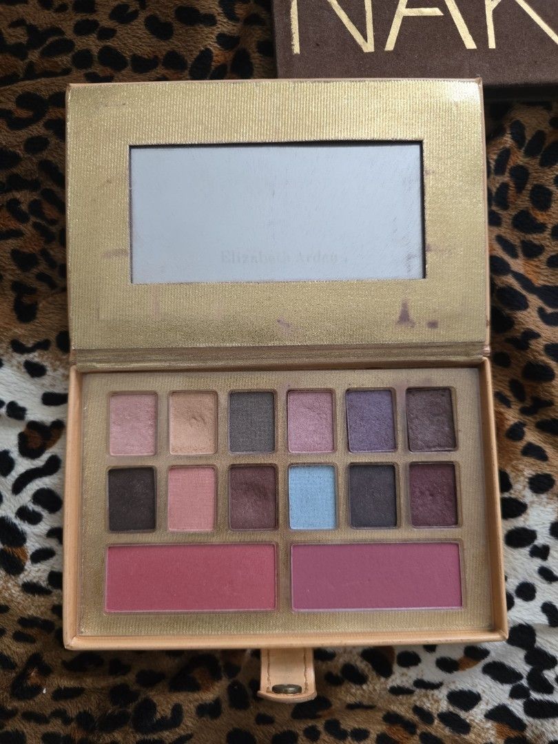 Elizabeth Arden Eyeshadow & Blush Palette (Category: Makeup) located in Manila. Submitted by foxydivas (Listing ID 1445575384, Image 2). Description: - Elizabeth Arden Eyeshadow & Blush Palette - Includes 12 eyeshadow shades and 2 blush shades - Features a mix of shimmery and matte finishes - Comes in a book-like case with a built-in mirror - Exterior of the case has some marks - Ideal for travel or everyday makeup looks - bought it at 7k .