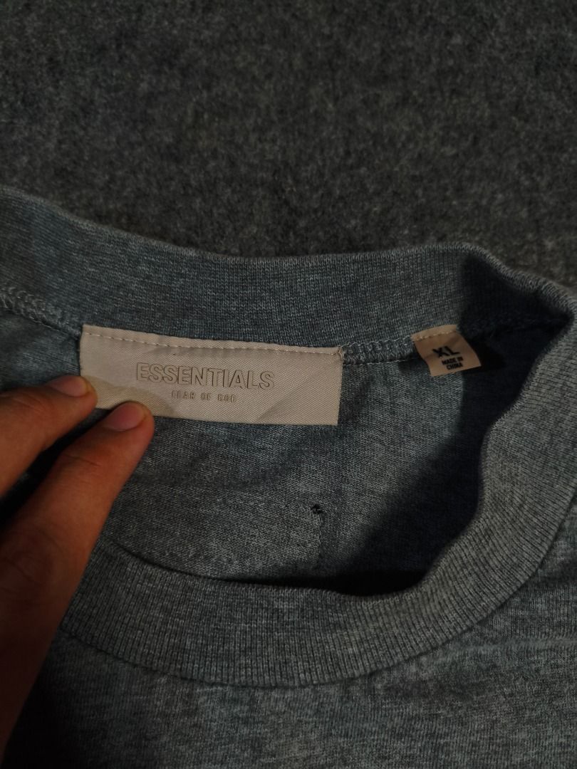 ESSENTIALS FOG '1977' Long Sleeve T-Shirt (Category: Tshirts & Polo Shirts ) located in Caloocan City. Submitted by pingpongggball (Listing ID 1443539845, Image 2). Description: - Grey long sleeve t-shirt 25x30 - Features a '1977' graphic print on the front - Classic crew neck design - Relaxed fit for comfortable casual wear - Ideal for everyday outfits.