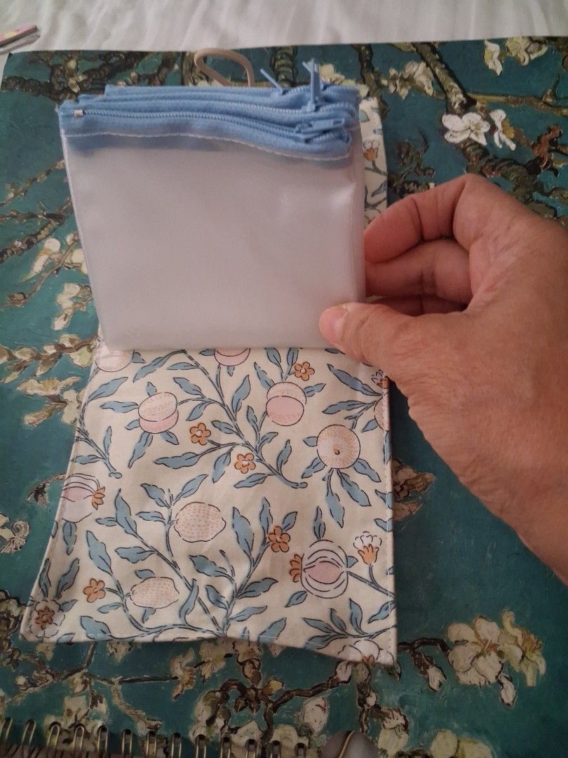Fabric Pouch with Zippered Compartment (Category: Purses & Pouches) located in Paranaque City. Submitted by lottenan (Listing ID 1445429017, Image 3). Description: - Adorable fabric pouch with a charming peach and floral print. - Secure button closure on the outside. - Includes a convenient clear zippered compartment inside. - Ideal for organizing stationery, makeup, accessories, and other small items. - Features a pleasant fabric texture. - Comp