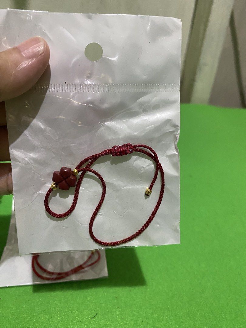 Fengshui Cinnabar Lucky Clover Red String Lucky Charm Bracelet (Category: Bracelets) located in Manila. Submitted by resi.diaz (Listing ID 1445597966, Image 3). Description: - Priced per set of 2. - Two red string bracelets included. - Each features a cute clover charm. - Accented with small gold beads. - Adjustable tie closure for a perfect fit. - Excellent for good luck or as a stylish accessory. - Ideal for gifting or personal wear. - Both bra