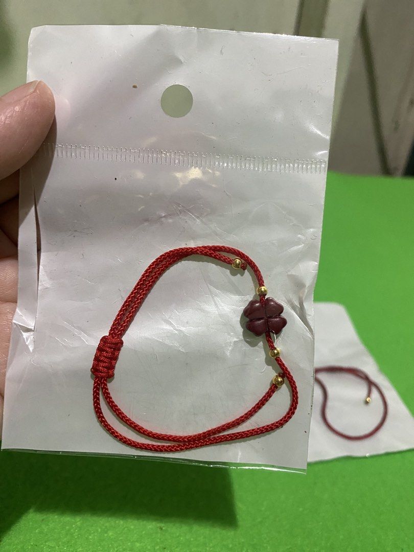 Fengshui Cinnabar Lucky Clover Red String Lucky Charm Bracelet (Category: Bracelets) located in Manila. Submitted by resi.diaz (Listing ID 1445597966, Image 2). Description: - Priced per set of 2. - Two red string bracelets included. - Each features a cute clover charm. - Accented with small gold beads. - Adjustable tie closure for a perfect fit. - Excellent for good luck or as a stylish accessory. - Ideal for gifting or personal wear. - Both bra