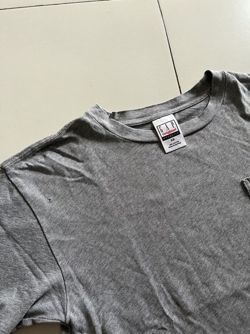 GAP Original Grey Pocket T-Shirt (Category: Tshirts & Polo Shirts ) located in Quezon City. Submitted by mbaut (Listing ID 1445505733, Image 2). Description: - Classic grey GAP pocket tee - Simple and versatile design - Ideal for everyday wear - Please check photos for condition details.