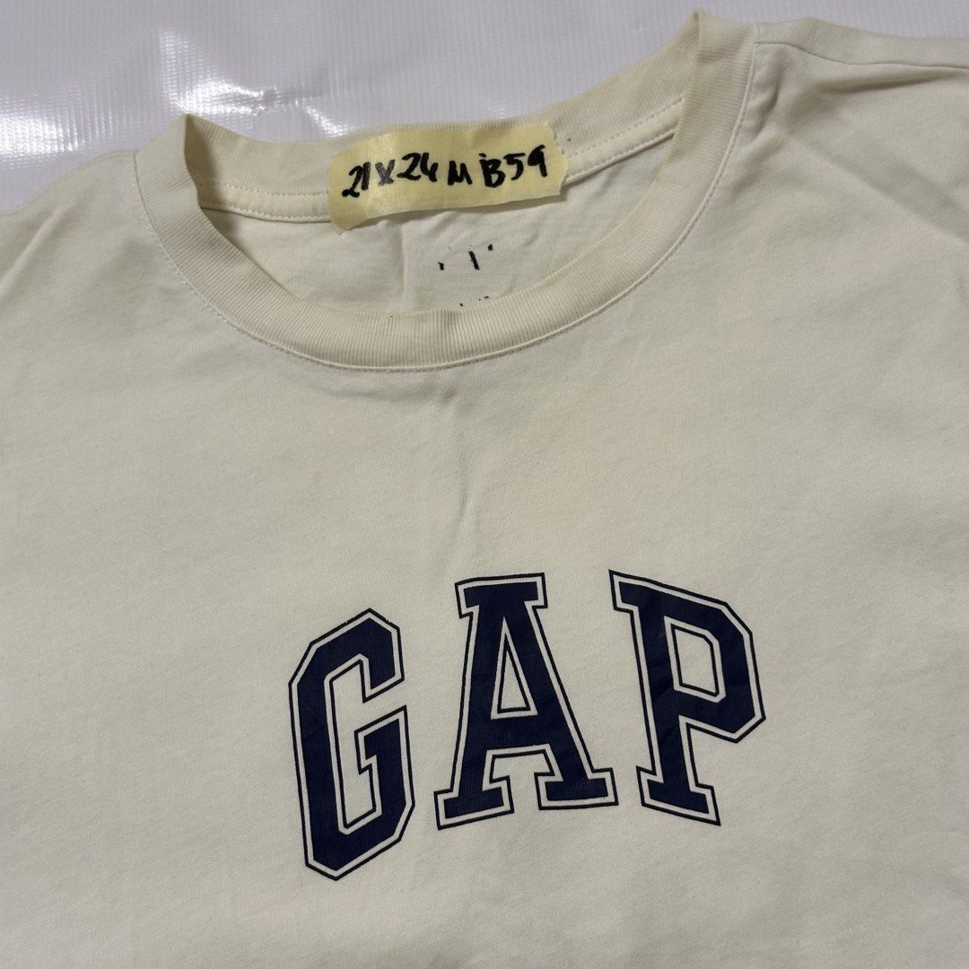 Gap T-shirt Cream Navy Logo (Category: Tshirts & Polo Shirts ) located in Manila. Submitted by johnedel_james (Listing ID 1445563243, Image 1). Description: - Cream colored Gap t-shirt - Classic navy blue Gap logo on chest - 100% cotton fabric - Size: US/GB Medium - Perfect for everyday wear.