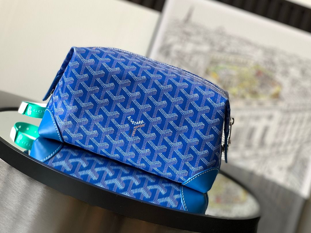 Goyard Blue Cosmetic Bag (Category: Luxury Bags & Wallets) located in Caloocan City. Submitted by lindyvanjk96455 (Listing ID 1445431346, Image 1). Description: - Authentic Goyard cosmetic bag in classic blue pattern. - Features elegant leather trim. - Comes with two distinctive green handles. - Ideal for keeping your travel or everyday essentials organized. - A chic and practical accessory for any occasion..