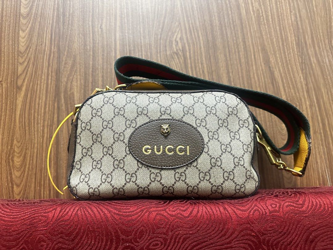 Gucci GG Supreme Tiger Head Crossbody Bag (Category: Luxury Bags & Wallets) located in Antipolo. Submitted by happinessprelove (Listing ID 1445554607, Image 2). Description: - Authentic Gucci crossbody bag - Classic GG Supreme canvas - Iconic tiger head and Gucci logo on front - Signature green and red stripe strap - Interior with floral print lining - Ideal for everyday use.