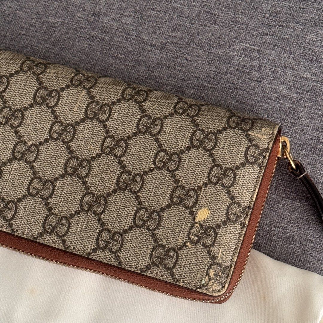 GUCCI GG Supreme Zip Around Wallet (Category: Luxury Bags & Wallets) located in Quezon City. Submitted by marketbuenaobra (Listing ID 1445464552, Image 2). Description: Authentic Gucci GG Supreme Zip Around Wallet in beige/ebony monogram canvas with brown leather trim. Comes with: ✔ Original Gucci box ✔ Gucci dustbag ✔ Care booklet/card Condition: •Fully functional zipper •Interior remains usable •Visible peeling on exterior canvas, Please manage