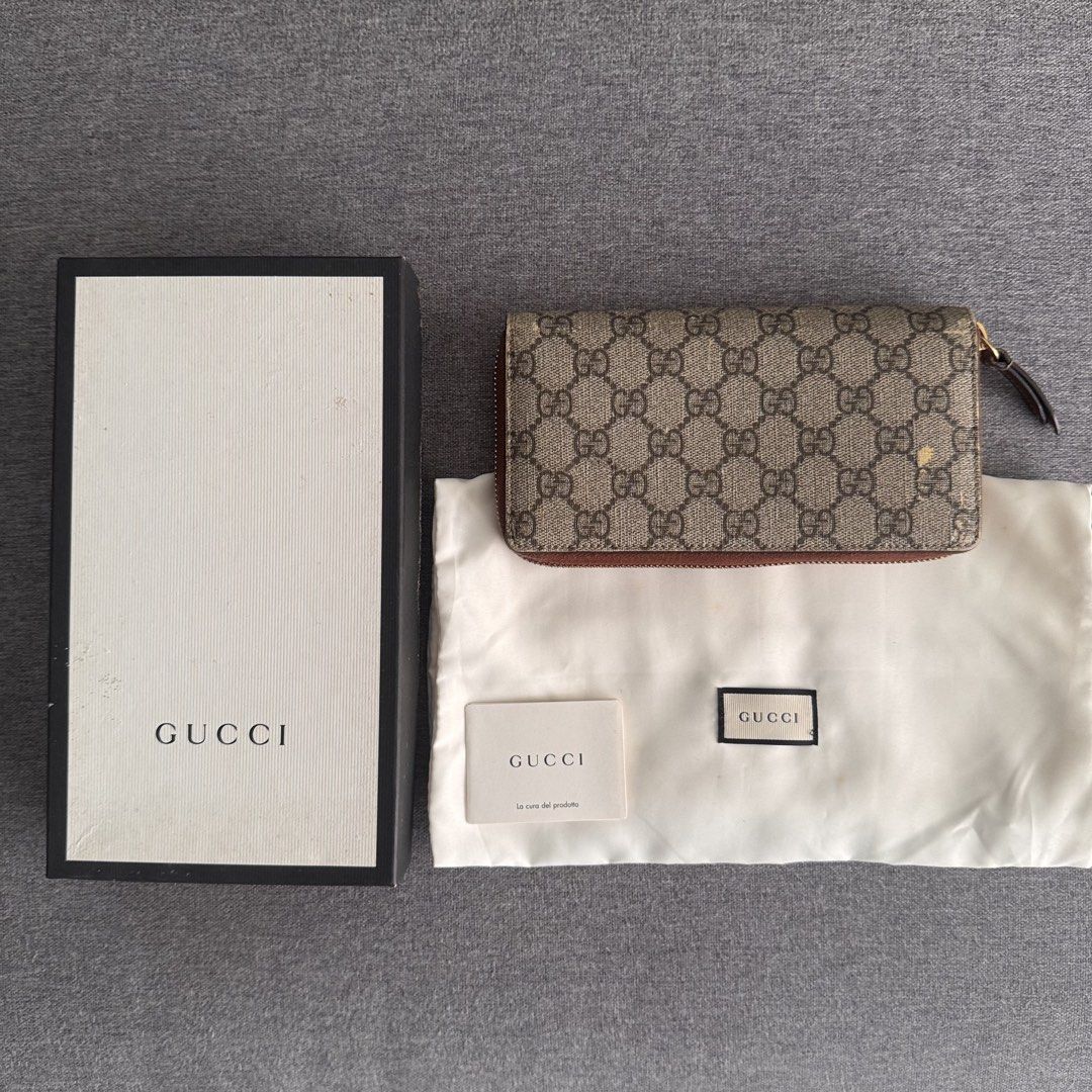 GUCCI GG Supreme Zip Around Wallet (Category: Luxury Bags & Wallets) located in Quezon City. Submitted by marketbuenaobra (Listing ID 1445464552, Image 1). Description: Authentic Gucci GG Supreme Zip Around Wallet in beige/ebony monogram canvas with brown leather trim. Comes with: ✔ Original Gucci box ✔ Gucci dustbag ✔ Care booklet/card Condition: •Fully functional zipper •Interior remains usable •Visible peeling on exterior canvas, Please manage