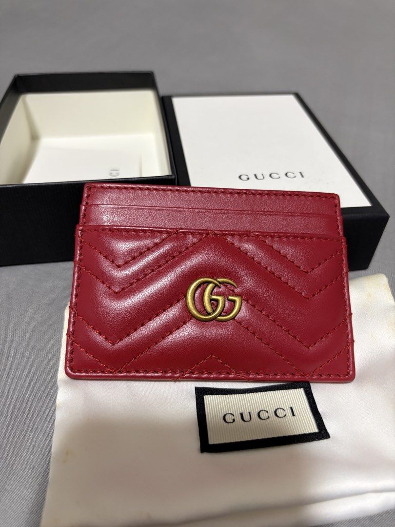 Gucci Cardholder (Category: Luxury Bags & Wallets) located in Quezon City. Submitted by shopwithmycloset (Listing ID 1445450756, Image 1). Description: Authentic Gucci Marmont card holder Red matelassé leather with GG logo Includes box and dust bag Good as new seldom used Grab / lalamove .