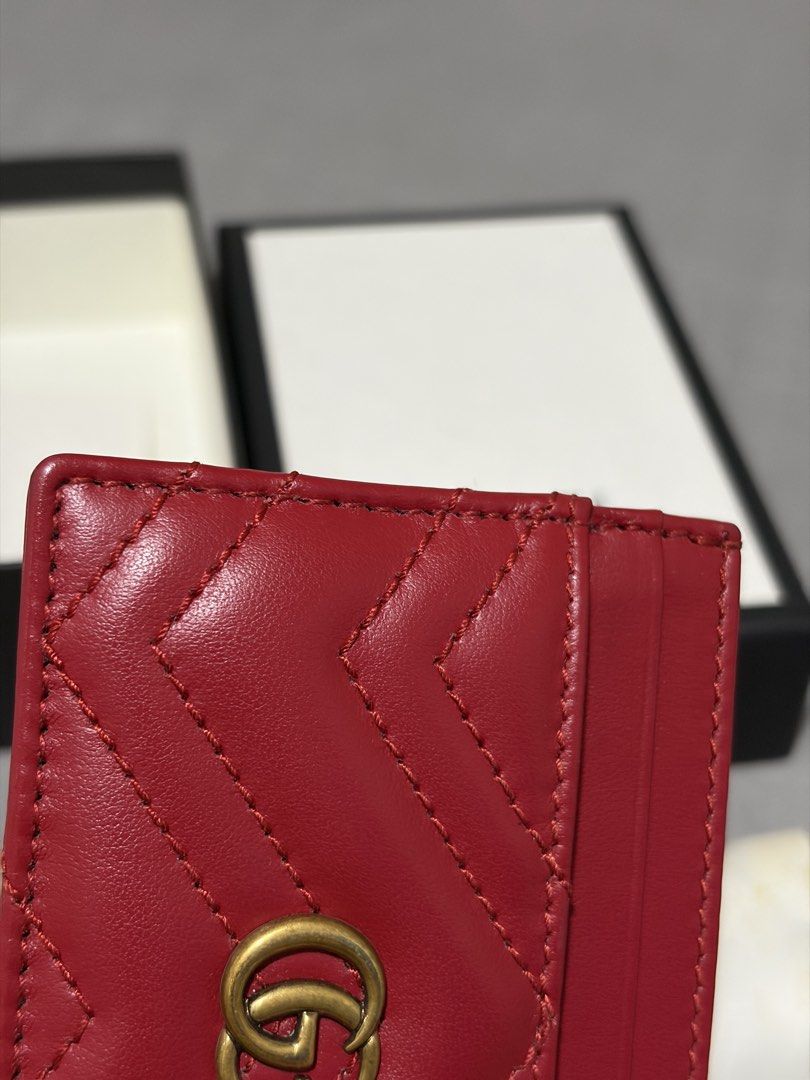Gucci Cardholder (Category: Luxury Bags & Wallets) located in Quezon City. Submitted by shopwithmycloset (Listing ID 1445450756, Image 3). Description: Authentic Gucci Marmont card holder Red matelassé leather with GG logo Includes box and dust bag Good as new seldom used Grab / lalamove .