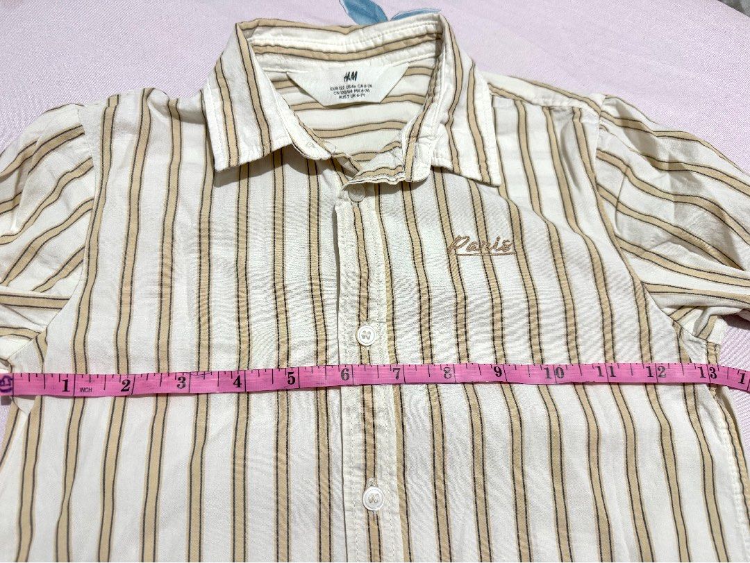 H&M Striped Long Sleeve Shirt (Category: Babies & Kids Fashion) located in Cainta. Submitted by ZPeyyy (Listing ID 1445533974, Image 3). Description: - H&M white and tan striped long sleeve shirt - Small embroidered detail on the chest - Button-up front closure - Perfect for casual wear or smart casual outfits - Please check photos for detailed measurements.