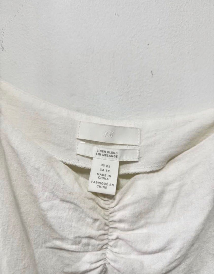 H&M White Linen Puff Sleeves Blouse Top (Category: Blouses) located in Cavite. Submitted by casingpavements (Listing ID 1445514952, Image 3). Description: Can fit medium to large Stretchable Sleeves.