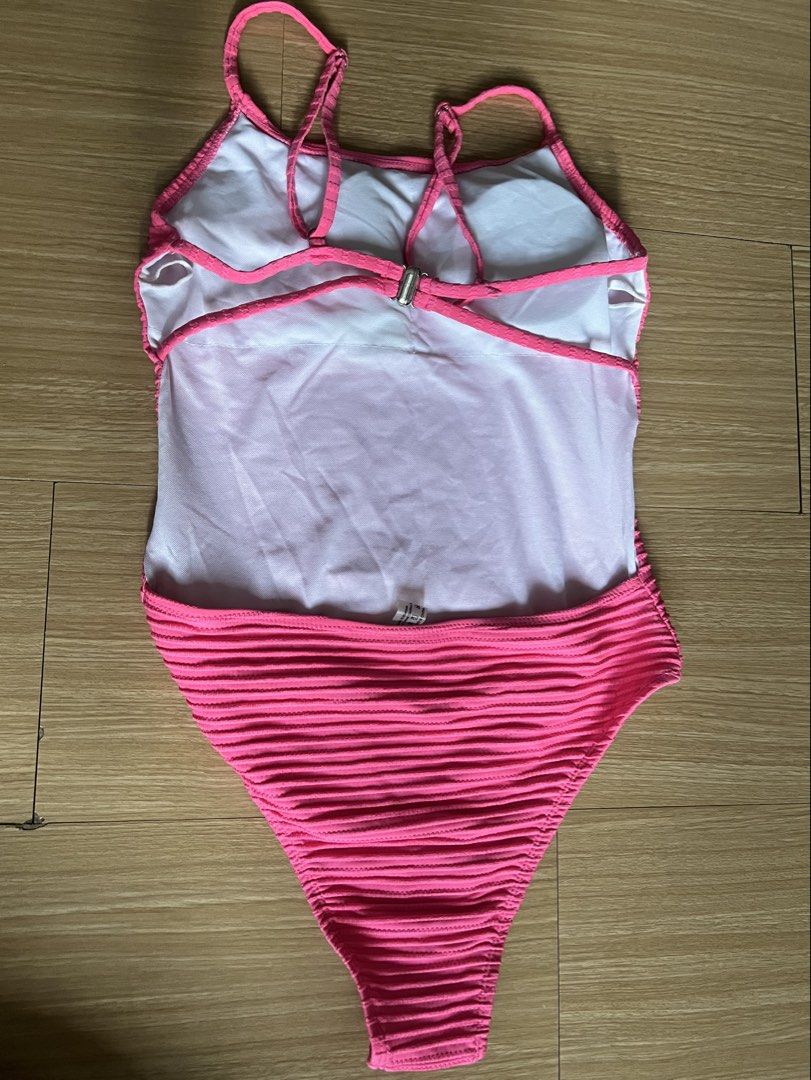 Hot Pink Ribbed One-Piece Swimsuit (Category: Bikinis & Swimsuits) located in Makati City. Submitted by nat____ (Listing ID 1445507830, Image 2). Description: - NEVER WORN - Thin straps with a chic criss-cross back detail - Convenient clasp closure at the back - Adjustable sleeves - Size can fit S-M.