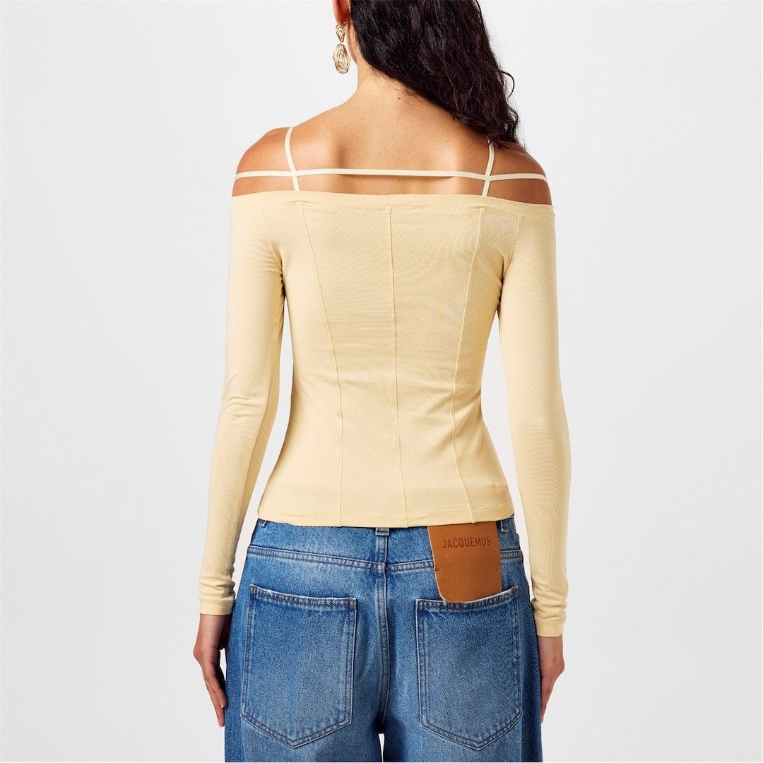 Jacquemus Le T-Shirt Sierra (Category: Blouses) located in Manila. Submitted by mnlhappybattle (Listing ID 1445552335, Image 2). Description: Jacquemus Le T-Shirt Sierra Tagged size : MEDIUM Dimensions CHEST - 15” LENGTH - 18” SHOULDERS - 18” SLEEVE - 17.5” Jacquemus presents the Le T-Shirt Sierra inspired by the opulent Le Chouchou Fall Winter '23 collection. Adorned with the signature logo embellished on the chest strap, serving as a symbol of 