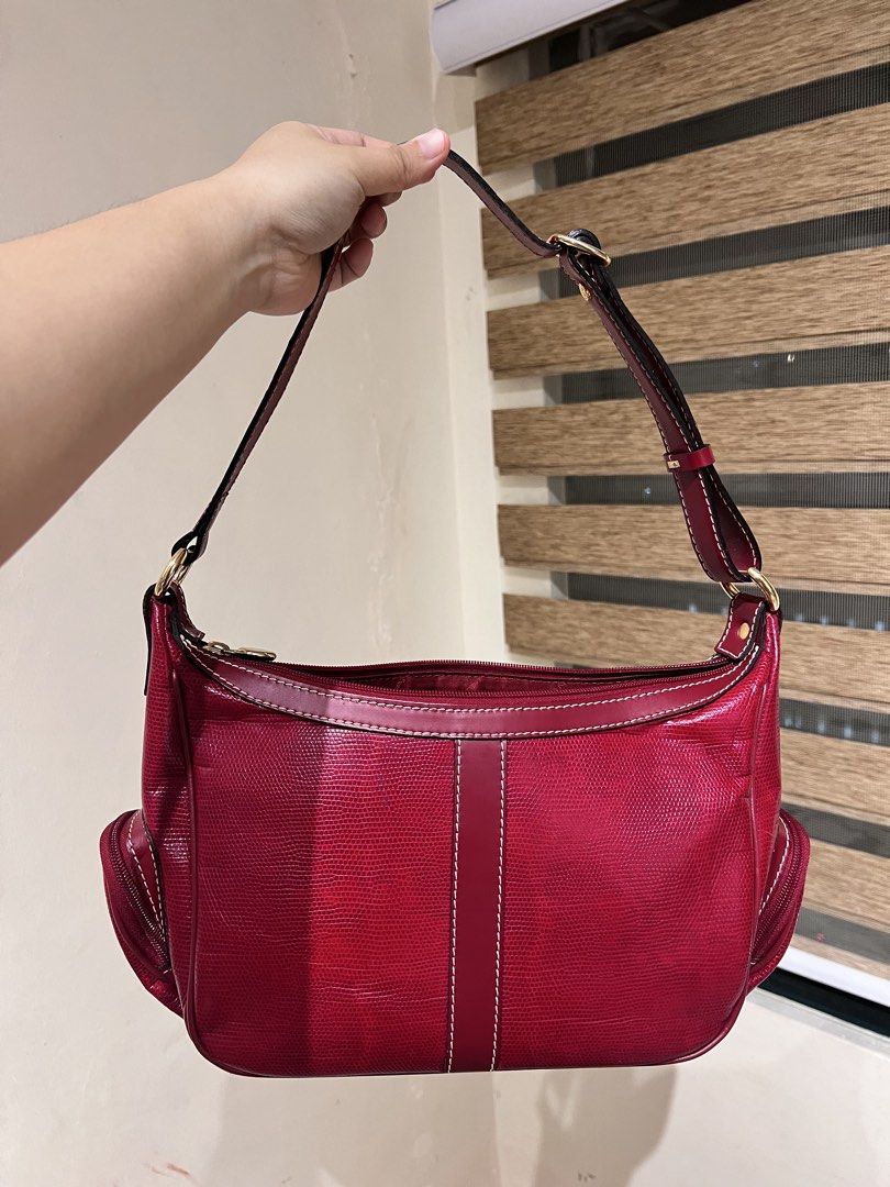 Lancel Paris Red Leather Shoulder Bag (Category: Luxury Bags & Wallets) located in Manila. Submitted by izzy_mndz (Listing ID 1445584933, Image 2). Description: Lancel is particularly famous for its high-quality leather goods, elegant handbags, and accessories. Founded in Paris in 1876. This is a used bag but still very good condition. Please look at some slight flaws on photo number 4. Nonetheless, it is a pretty pop of color, spacious, and have
