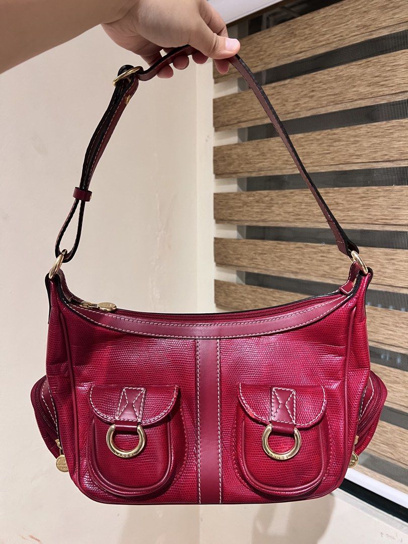 Lancel Paris Red Leather Shoulder Bag (Category: Luxury Bags & Wallets) located in Manila. Submitted by izzy_mndz (Listing ID 1445584933, Image 1). Description: Lancel is particularly famous for its high-quality leather goods, elegant handbags, and accessories. Founded in Paris in 1876. This is a used bag but still very good condition. Please look at some slight flaws on photo number 4. Nonetheless, it is a pretty pop of color, spacious, and have