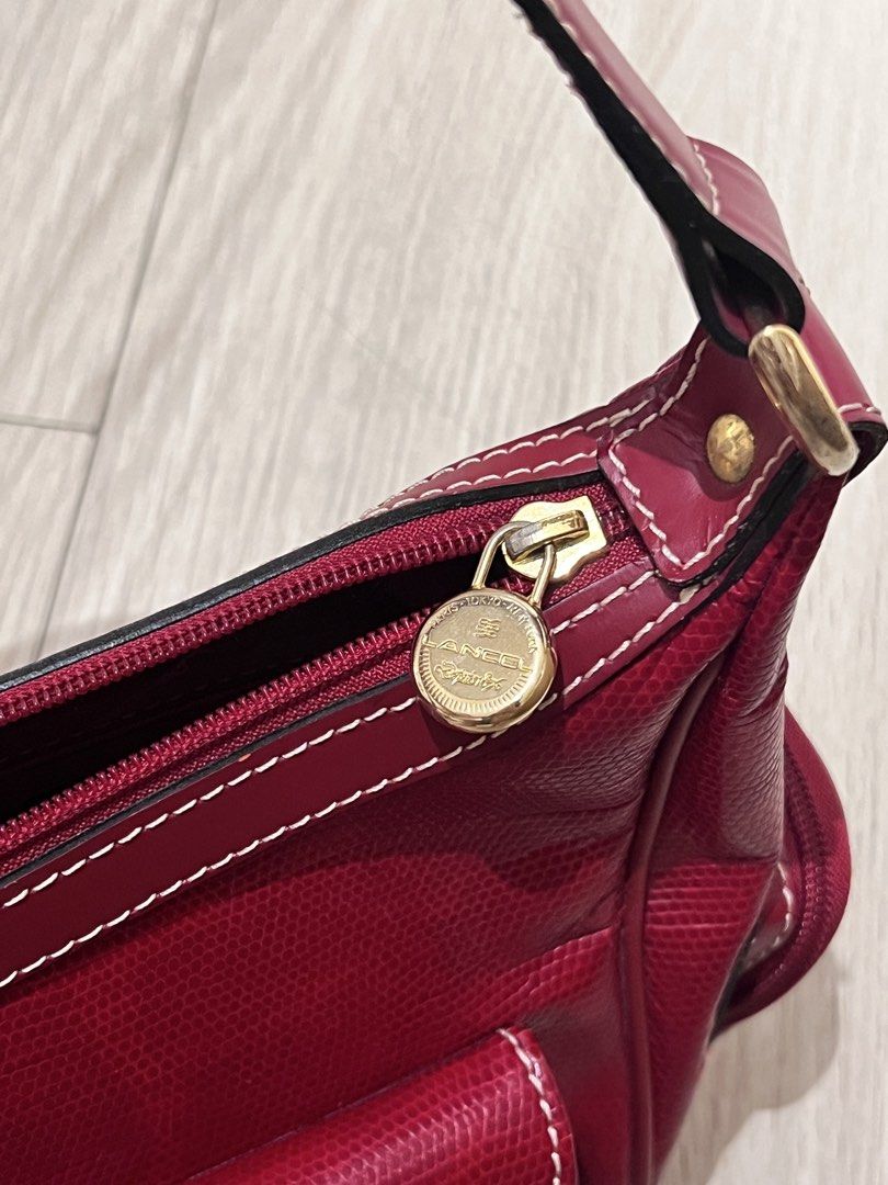 Lancel Paris Red Leather Shoulder Bag (Category: Luxury Bags & Wallets) located in Manila. Submitted by izzy_mndz (Listing ID 1445584933, Image 3). Description: Lancel is particularly famous for its high-quality leather goods, elegant handbags, and accessories. Founded in Paris in 1876. This is a used bag but still very good condition. Please look at some slight flaws on photo number 4. Nonetheless, it is a pretty pop of color, spacious, and have