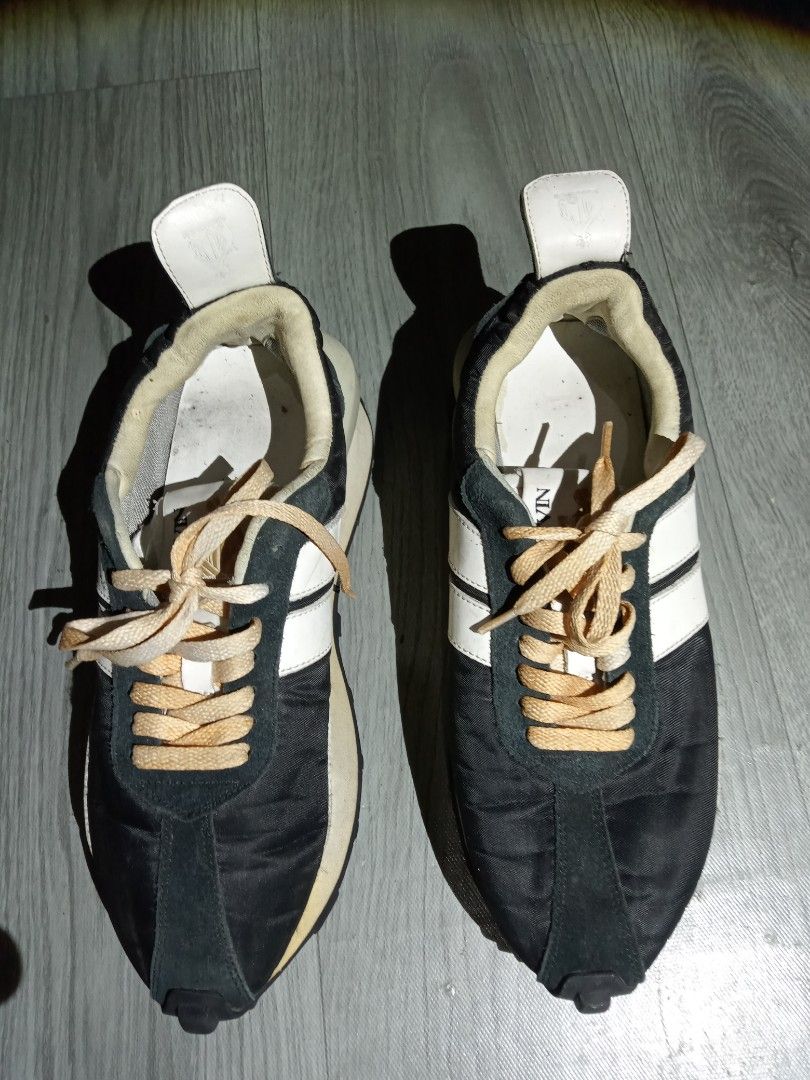 Lanvin Black White Suede Nylon Sneakers (Category: Sneakers) located in General Santos City (Dadiangas). Submitted by loloikoh63127 (Listing ID 1445521060, Image 1). Description: - Lanvin sneakers in black, white, and grey. - Suede and nylon upper for a premium feel. - Chunky sole with signature Lanvin branding. - Light tan laces add a unique touch. - Pre-loved condition with some dirt on soles and inner soles. - Plenty of wear left, ready for yo
