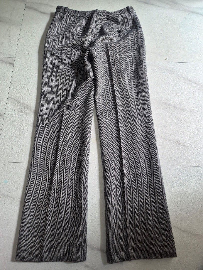 Lauren Ralph Lauren Herringbone Flared Trousers (Category: Other Bottoms) located in Bulacan. Submitted by vince4593 (Listing ID 1445431440, Image 2). Description: - Lauren Ralph Lauren trousers - Classic dark grey herringbone pattern - Flared leg style - Front button and zip closure - Fully lined interior - Ideal for smart casual outfits - Please check photos for condition details.