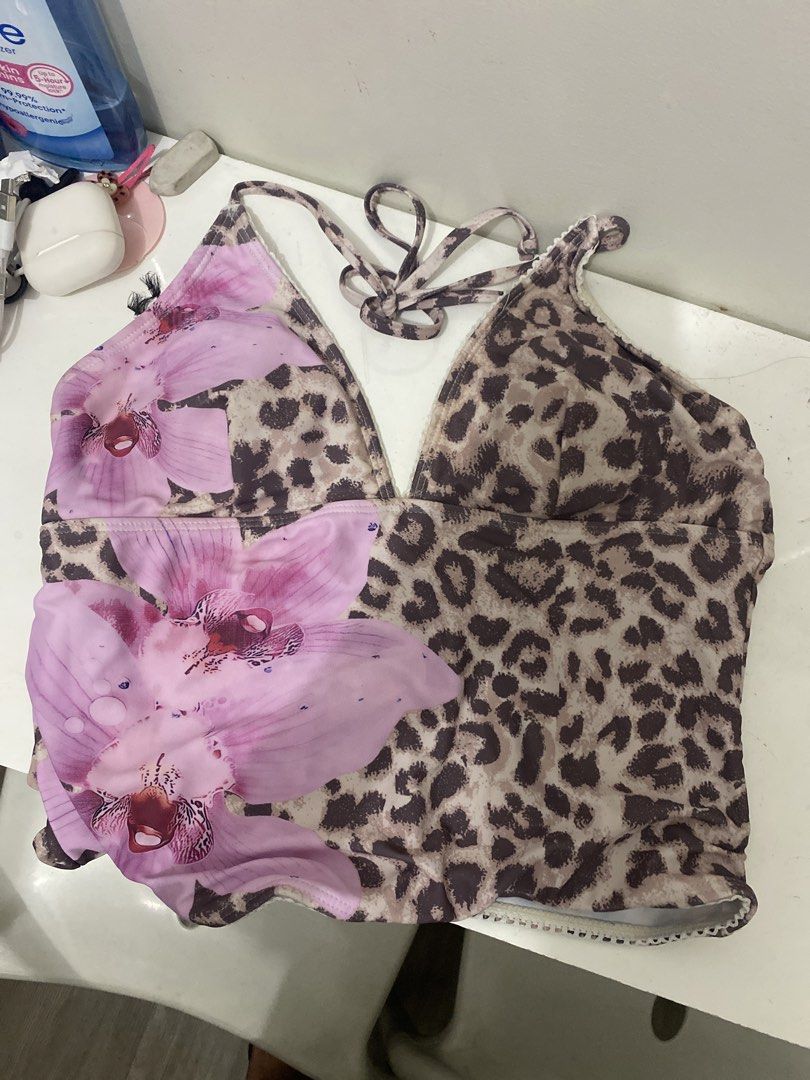 Tankini Leopard Print & Orchid Halter Bikini Set (Category: Bikinis & Swimsuits) located in San Juan City. Submitted by helpabaddietodecclutter (Listing ID 1445578987, Image 2). Description: - Cute bikini set - Leopard print with orchid design - Halter neck top with tie closure - Matching tie-side bottoms - Size: L - Ideal for beach or pool.