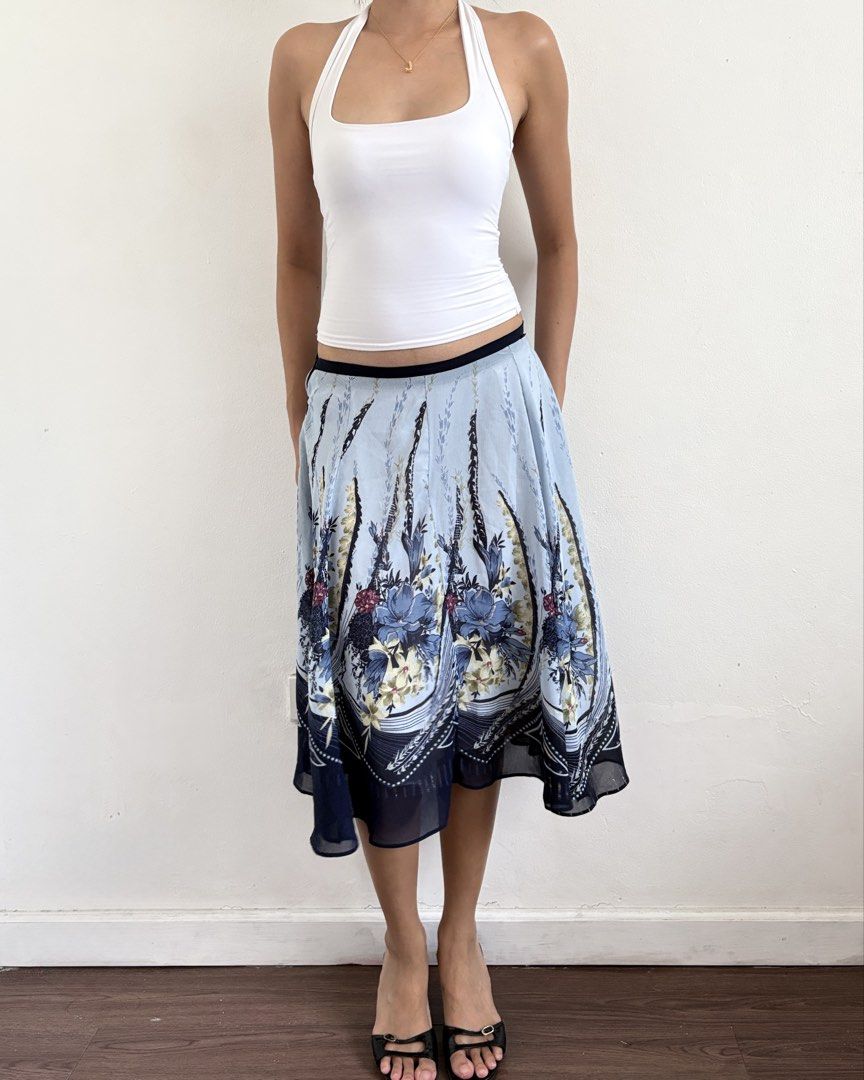 Light Blue Floral Midi Skirt (Category: Skirts) located in Manila. Submitted by secondtimearound__ (Listing ID 1445524368, Image 3). Description: Flowy blue floral midi skirt with navy trim. Light, airy fabric perfect for warm weather. Black waistband..