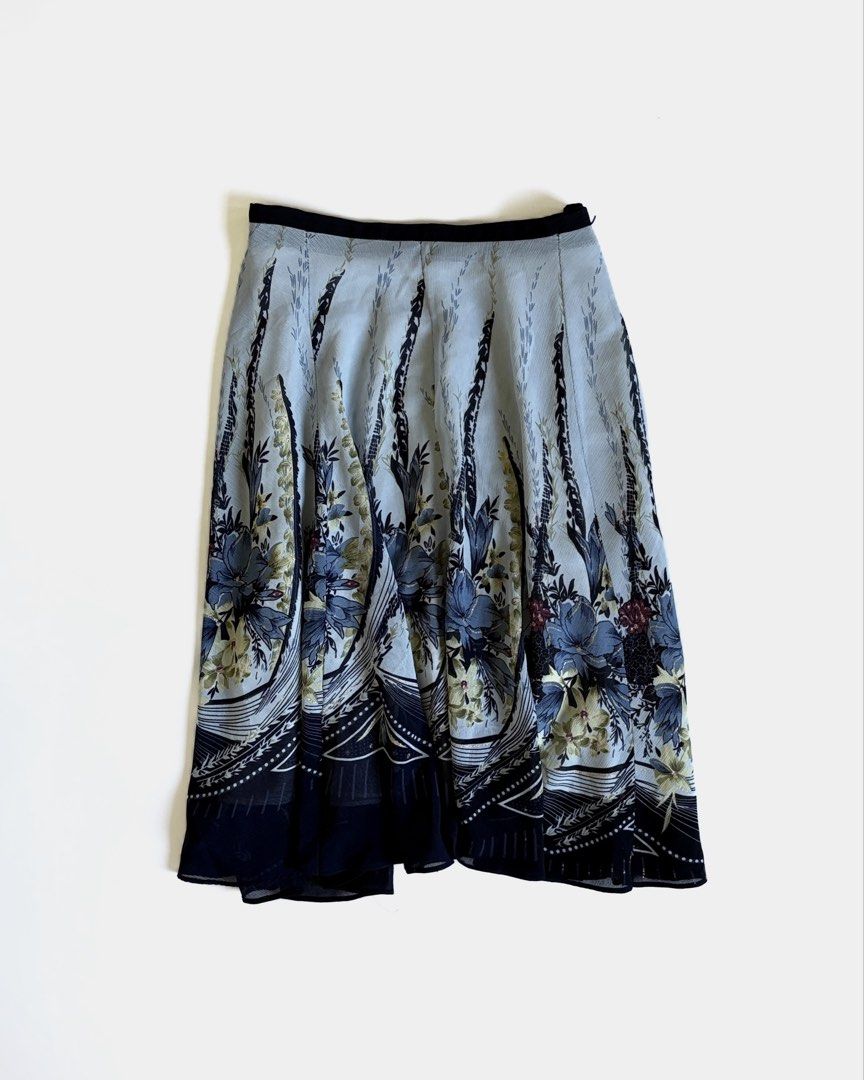Light Blue Floral Midi Skirt (Category: Skirts) located in Manila. Submitted by secondtimearound__ (Listing ID 1445524368, Image 1). Description: Flowy blue floral midi skirt with navy trim. Light, airy fabric perfect for warm weather. Black waistband..