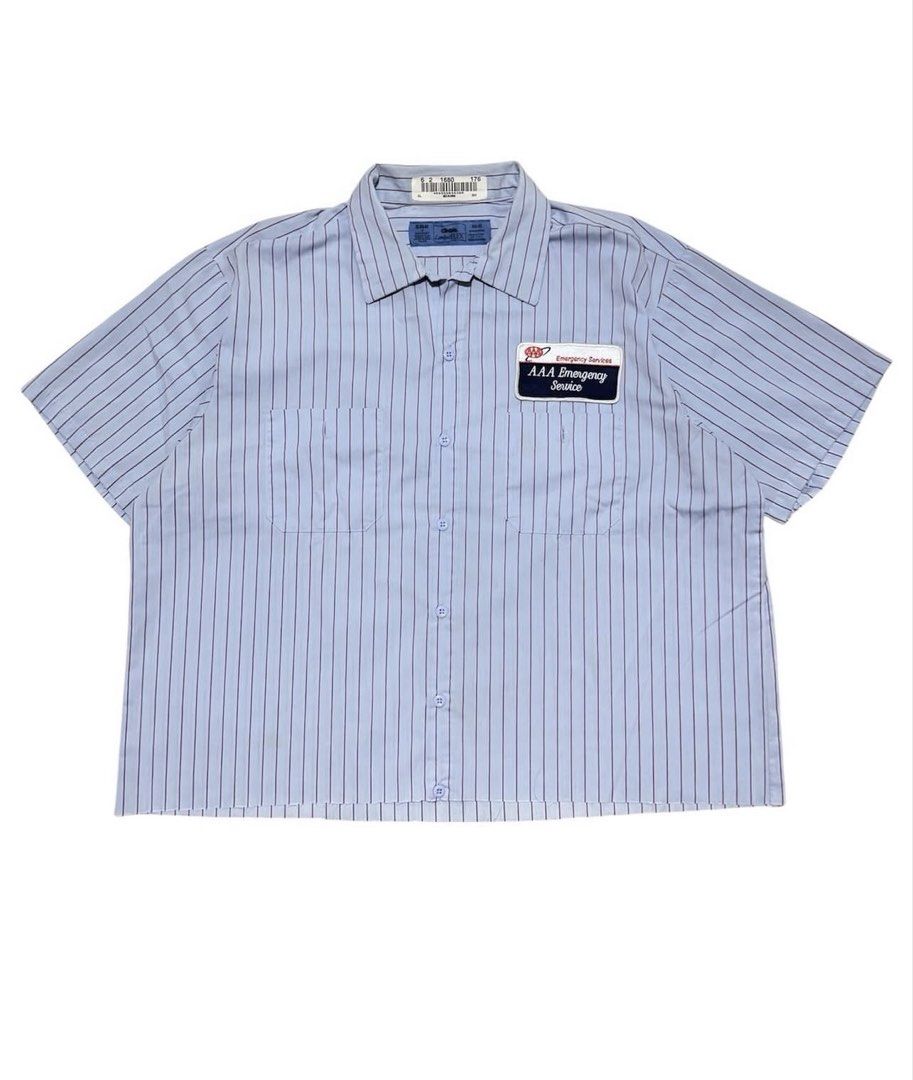 Light Blue Striped Work Shirt with AAA Emergency Service Patch (Category: Tshirts & Polo Shirts ) located in Antipolo. Submitted by nmstan (Listing ID 1445472717, Image 1). Description: - Light blue short-sleeved work shirt - Features dark vertical pinstripes - Two chest pockets with button closures - Left chest pocket has 'AAA Emergency Service' patch - Button-up front - Classic workwear style.