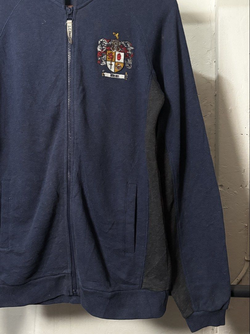l.l.bean Navy Blue Crest Zip-Up Jacket XS (Category: Coats, Jackets and Outerwear) located in Manila. Submitted by angelll444 (Listing ID 1445476815, Image 3). Description: - Medium 21x27 - Navy blue L.L.Bean zip-up jacket - Embroidered crest on chest - Dark grey side panels - Two front pockets - Ribbed collar, cuffs, and hem - Ideal for casual wear.