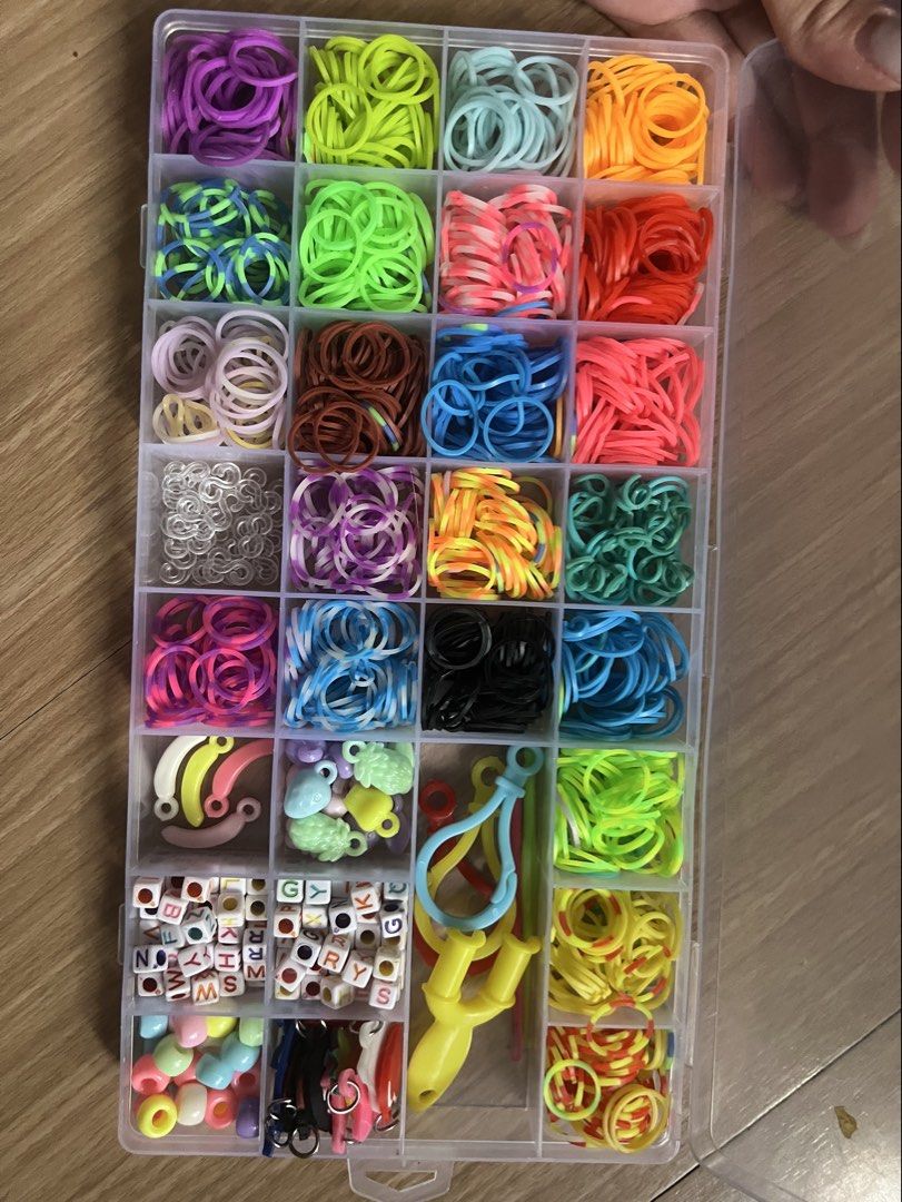 Loom Bands Bracelet Making Kit with Charms & Accessories (Category: Craft Supplies & Tools) located in Makati City. Submitted by nat____ (Listing ID 1445517324, Image 2). Description: - Assorted loom bands in various colors - Includes charms and beads for customization - Comes with a loom hook - All organized in a handy case - Suitable for kids and adults who enjoy crafting.