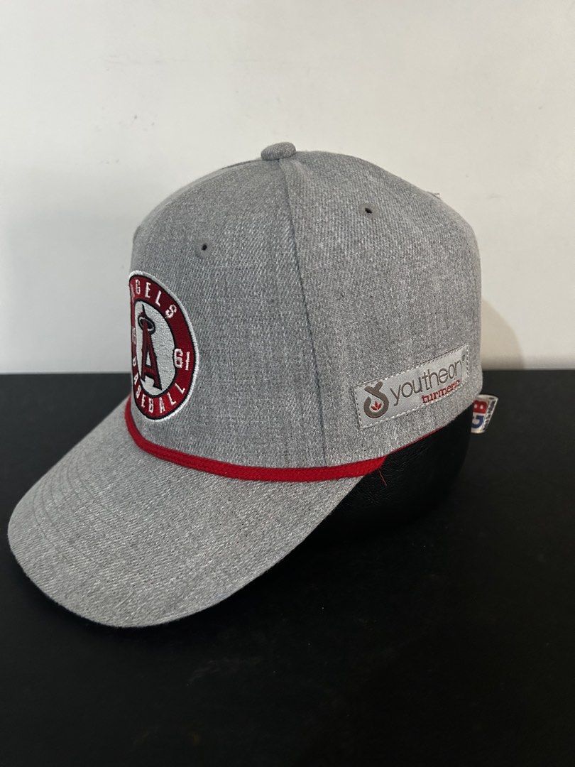 Los Angeles Angels Baseball Cap - Sixth "A" Logo (Category: Caps & Hats) located in Manila. Submitted by fierce_capgame (Listing ID 1445432783, Image 2). Description: - Grey Los Angeles Angels baseball cap - Features iconic 'A' logo - Includes '1961' and 'BASEBALL' text - Red rope detail across the brim - Made by Sixth "A" Promotions - Material: 100% Polyester - Ideal for any fan of the Angels.