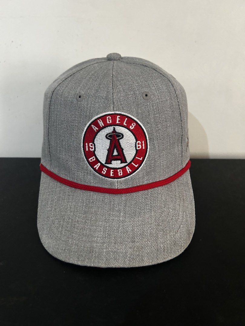 Los Angeles Angels Baseball Cap - Sixth "A" Logo (Category: Caps & Hats) located in Manila. Submitted by fierce_capgame (Listing ID 1445432783, Image 1). Description: - Grey Los Angeles Angels baseball cap - Features iconic 'A' logo - Includes '1961' and 'BASEBALL' text - Red rope detail across the brim - Made by Sixth "A" Promotions - Material: 100% Polyester - Ideal for any fan of the Angels.