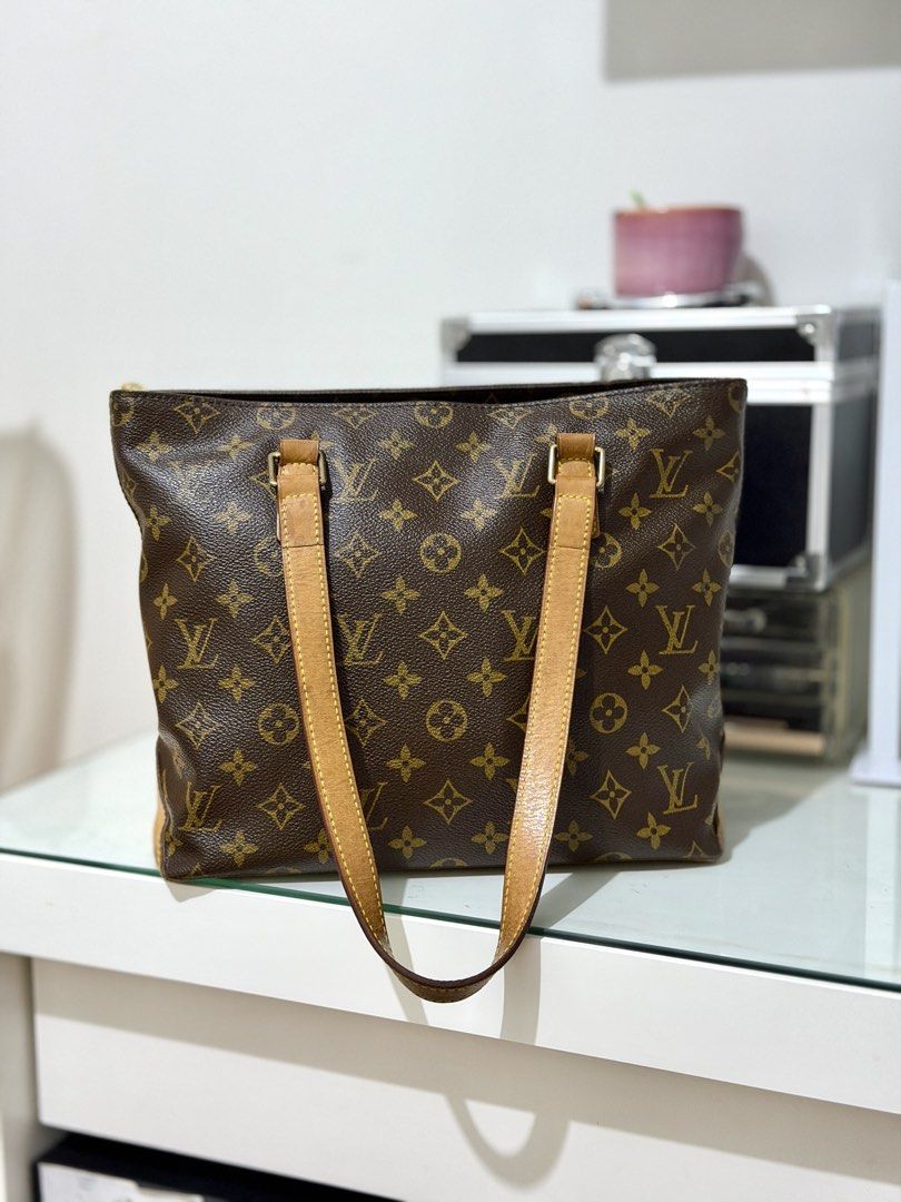 Rare Louis Vuitton Monogram Cabas Piano (Category: Luxury Bags & Wallets) located in Las Pinas. Submitted by shoppe.jasmineb (Listing ID 1445551127, Image 1). Description: Vintage Lv Cabas Piano. no cracks or tears in canvas. No foul smell. Zipper is working well. Can be used as an everyday bag 100% authentic moneyback if proven fake. 2nd hands sold around 40-80k. slightly negotiable - Classic Louis Vuitton tote bag in iconic monogram canvas. - F