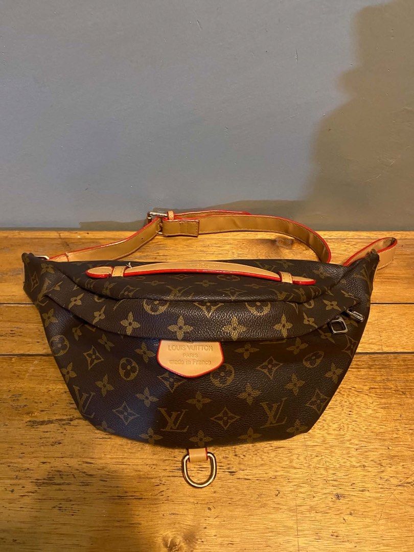 Louis Vuitton Monogram Canvas Bumbag (Category: Luxury Bags & Wallets) located in Cagayan de Oro. Submitted by timeless.ph (Listing ID 1445570355, Image 2). Description: Condition: RANK AB Model: Bumbag (M43644)Material: Monogram coated canvas with vachetta (natural cowhide) leather trimHardware: Gold-tone brass📏 SpecificationsMain Features: Zippered closure, top handle, adjustable belt strap, front D-ringInterior Lining: Cotton canvasWear Style