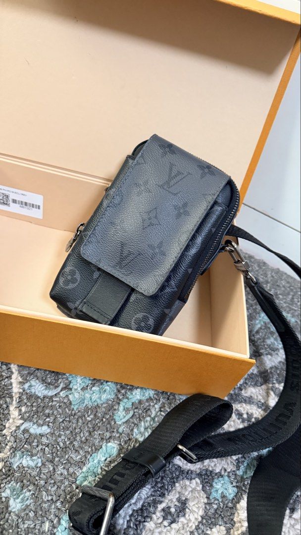 Louis Vuitton Monogram Eclipse Crossbody Bag (Category: Luxury Bags & Wallets) located in Las Pinas. Submitted by lanasmom (Listing ID 1445482717, Image 1). Description: - Authentic Louis Vuitton crossbody bag - Monogram Eclipse canvas in black and grey - Features a main zippered compartment - Front flap pocket with secure snap closure - Adjustable strap for comfortable wear - Comes with original box and paperbag - Ideal for everyday use - Authen