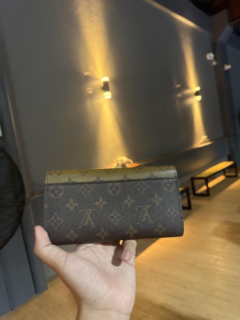 Louis Vuitton Monogram Wallet (Category: Luxury Bags & Wallets) located in Calamba. Submitted by leeadriannn796 (Listing ID 1445521043, Image 2). Description: - Classic Louis Vuitton wallet - Iconic monogram pattern - Brown and tan colorway - Fold-over design with snap closure - Plenty of space for cards and cash - Timeless piece for everyday use.