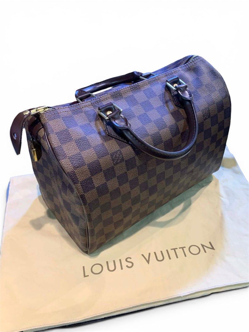 LOUIS VUITTON SPEEDY 30 (Category: Luxury Bags & Wallets) located in Dagupan City. Submitted by stylecycle_2025 (Listing ID 1445469996, Image 2). Description: This Louis Vuitton Speedy 30 bag features the iconic Damier Ebene checkered brown coated canvas. Rank A w/orig dustbag (GUARANTEED AUTHENTIC) DM for more details .