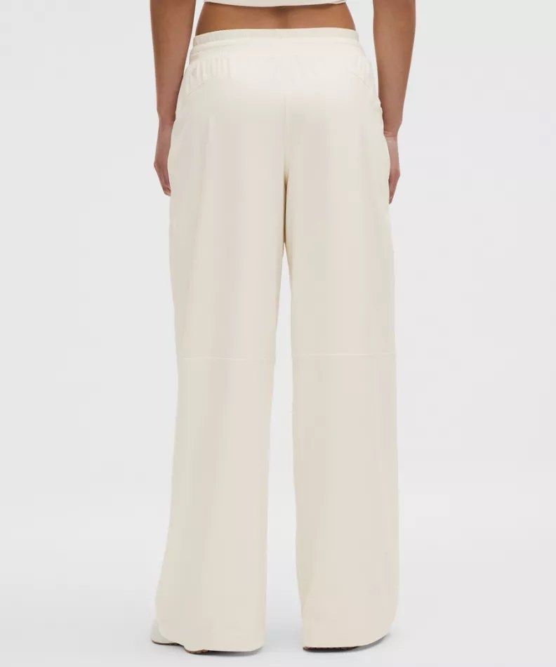 Lululemon Swift Wide Leg Mid-Rise Pants (Category: Other Bottoms) located in Pasig City. Submitted by perl2018 (Listing ID 1445595672, Image 3). Description: - Lululemon cream wide leg pants - Soft Align fabric - Mid-rise fit - Elastic waistband - Side pockets with zippers - Super comfy and flowy - Ideal for lounging or casual wear US6 Very flattering! With lining, not see through RFS Wrong size 😭😭😭😭 I really like this pants Mop Gcash UB BPI.